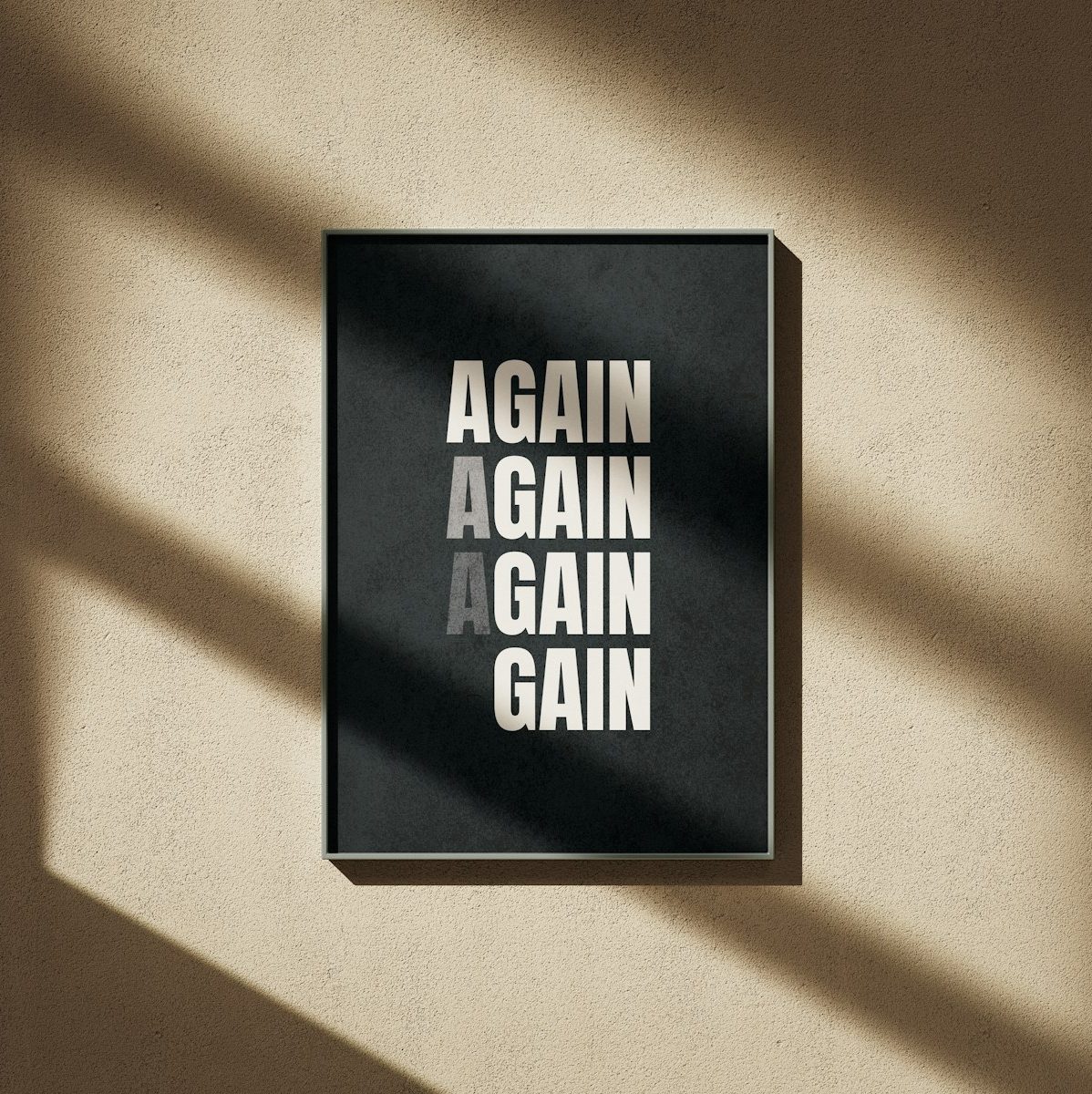 A black and white poster hanging on a wall